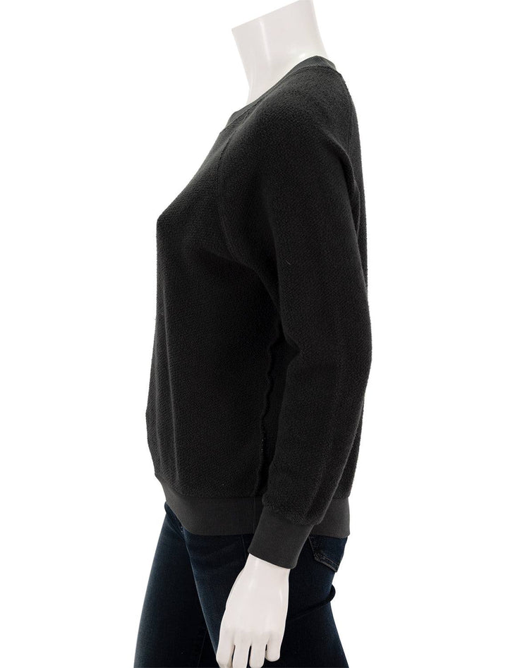 Side view of Perfectwhitetee's ziggy inside out sweatshirt in vintage black.