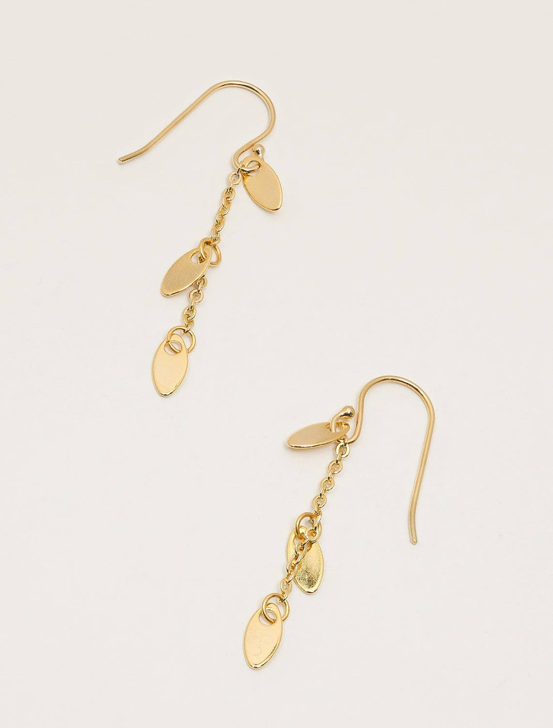top down flat view of dainty petal earrings