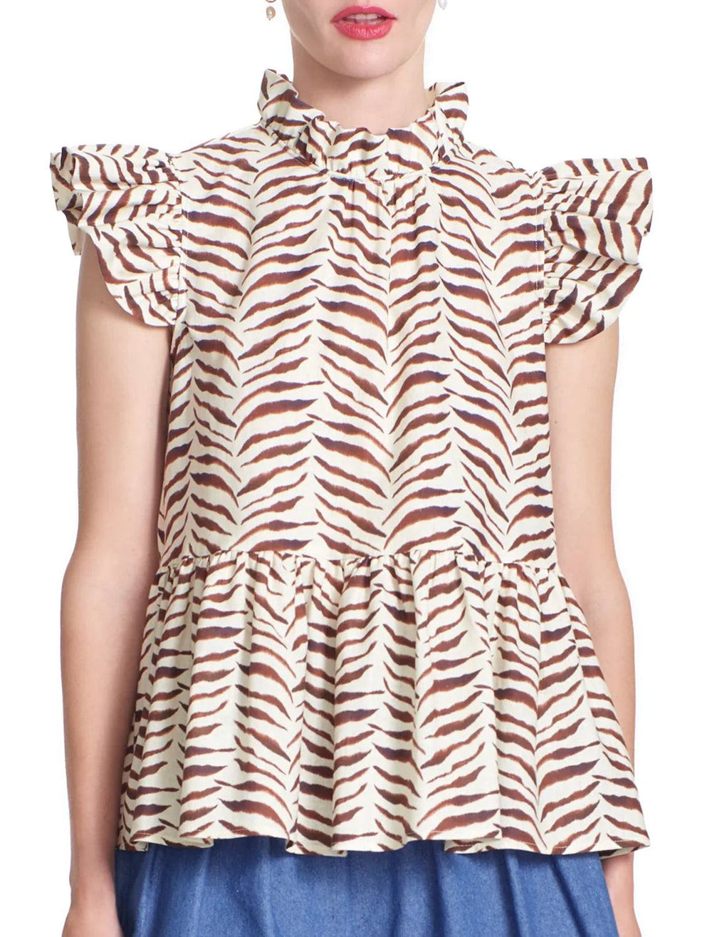 Model wearing Corey Lynn Calter's Aurora top in ivory and zebra.