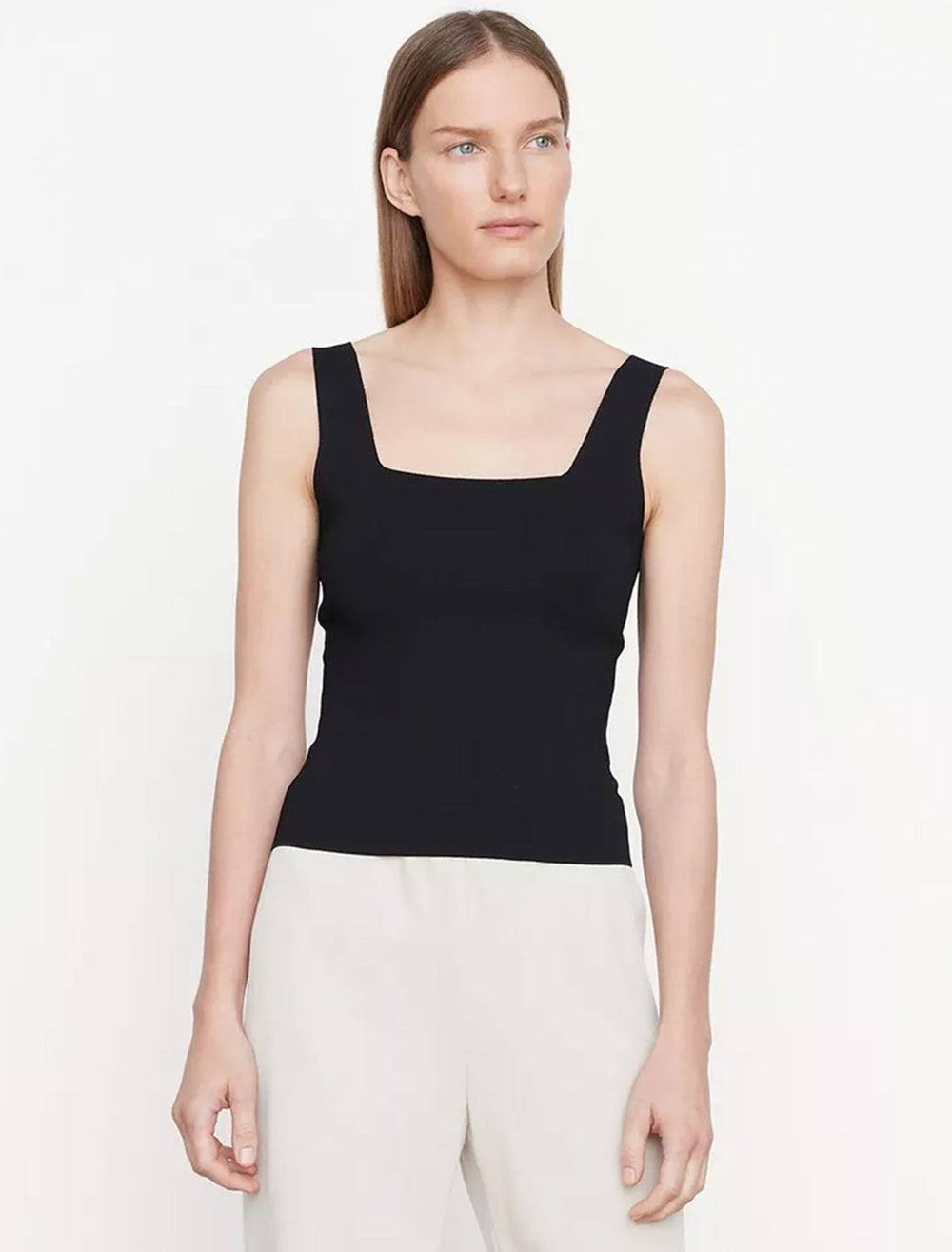 Model wearing Vince's square neck sweater tank in black.