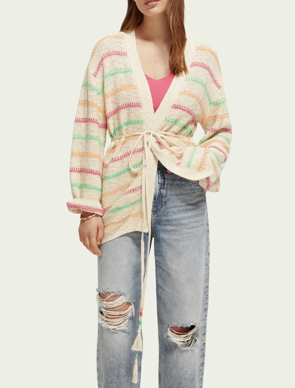 Model wearing Scotch & Soda's striped tie waist cardigan in vanilla.
