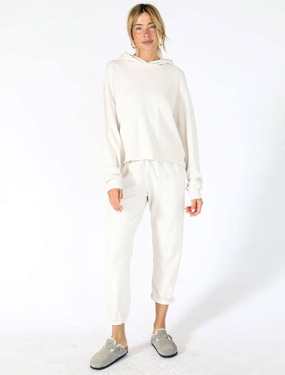 model wearing johnny sweatpants in sugar with a matching sweatshirt