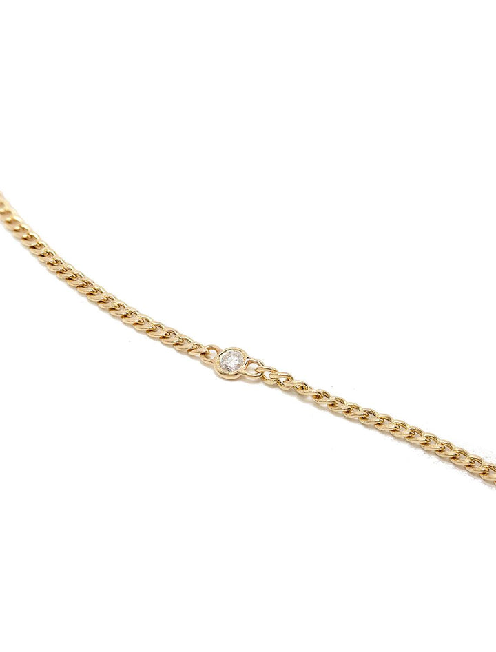 Close-up laydown of Zoe Chicco's 14k extra small curb chain with floating diamond bracelet | 6-7"