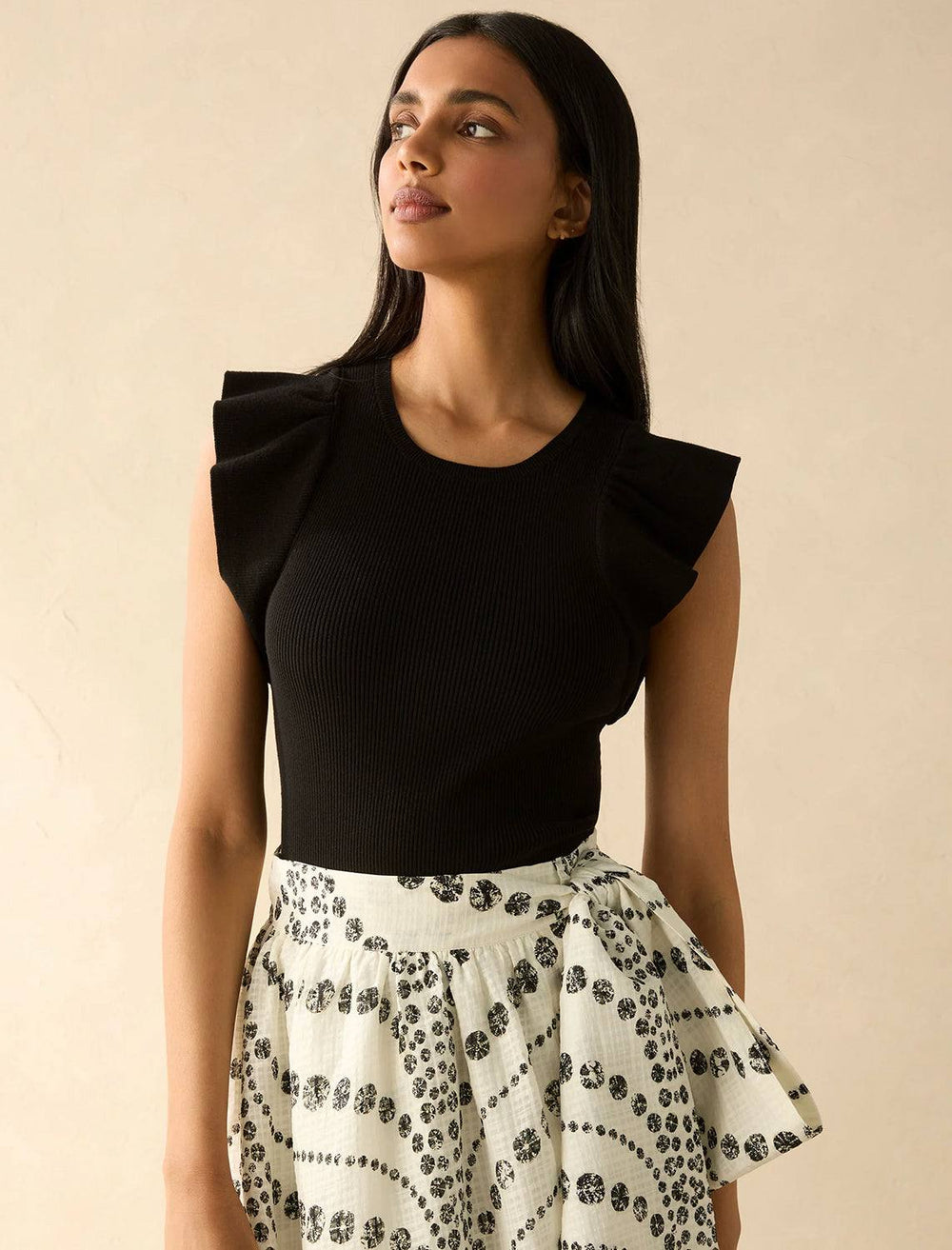 Model wearing Marie Oliver's rory top in black.