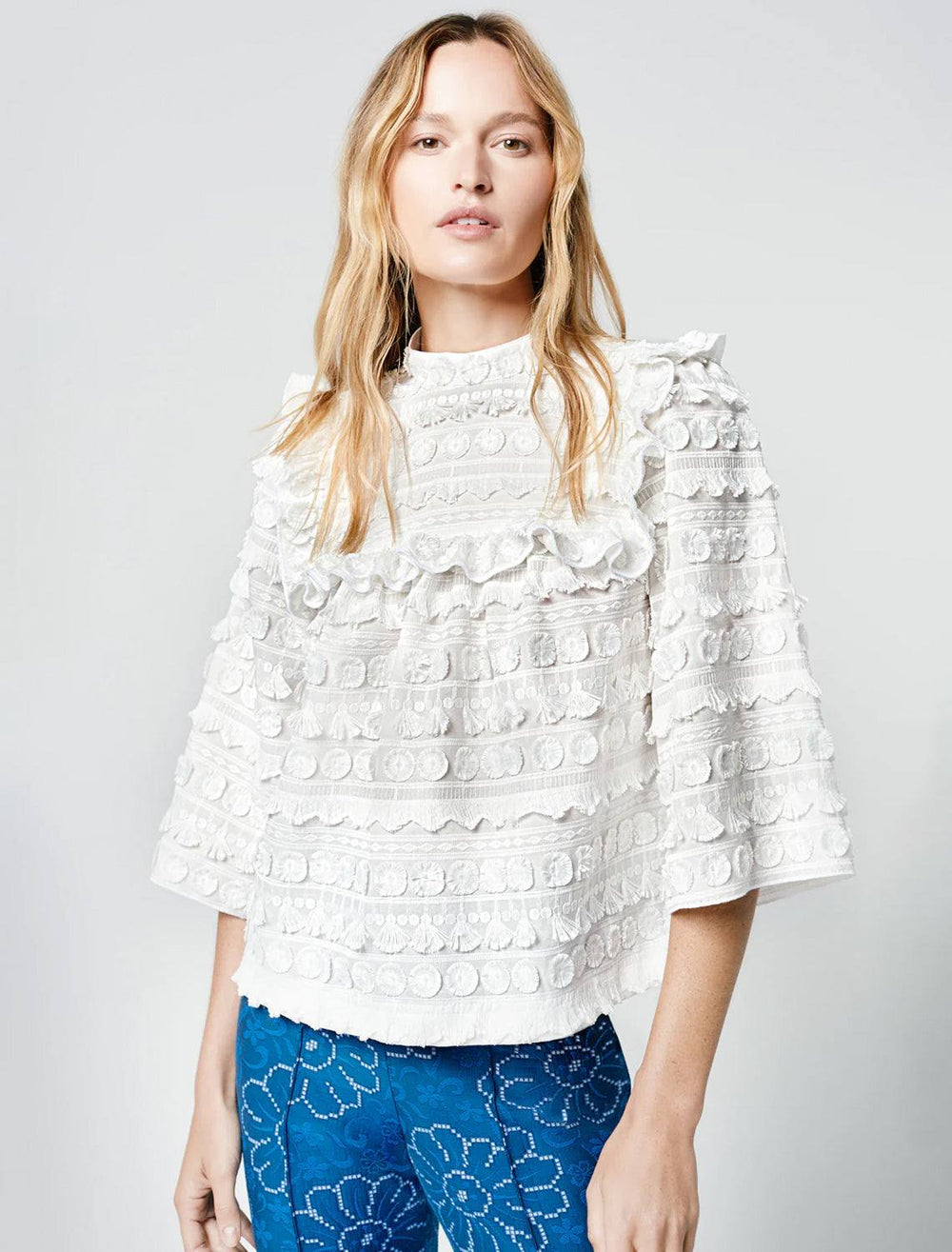 Model wearing Smythe's a line top in white.