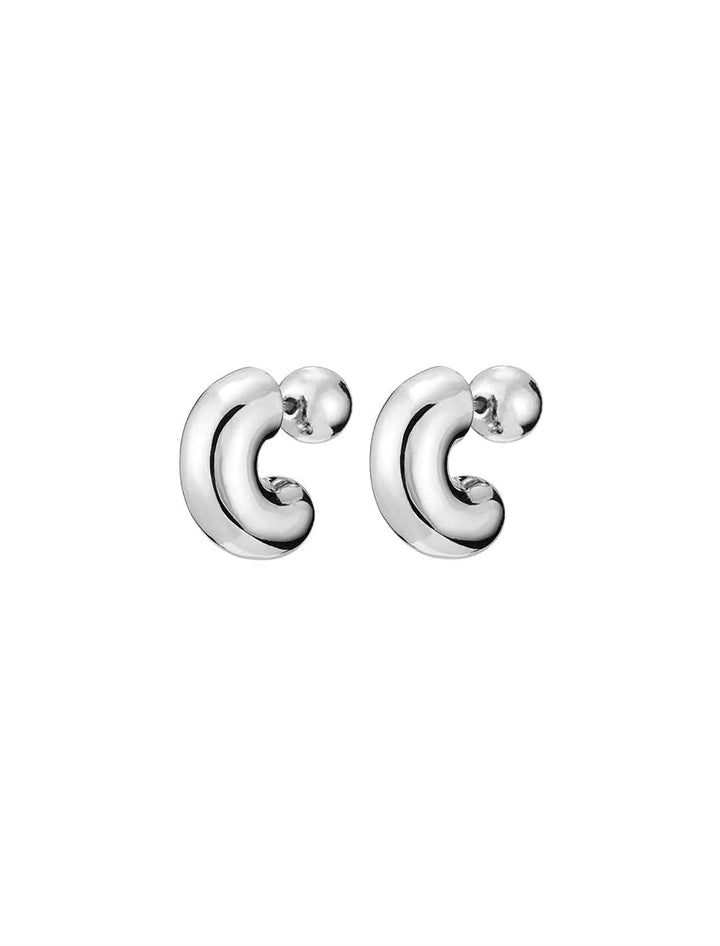 Front angle view of Jenny Bird's Small Tome Hoops in Silver Dipped Brass.