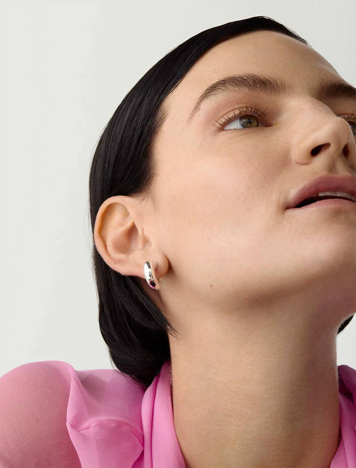 Model wearing Jenny Bird's Small Tome Hoops in Silver Dipped Brass.