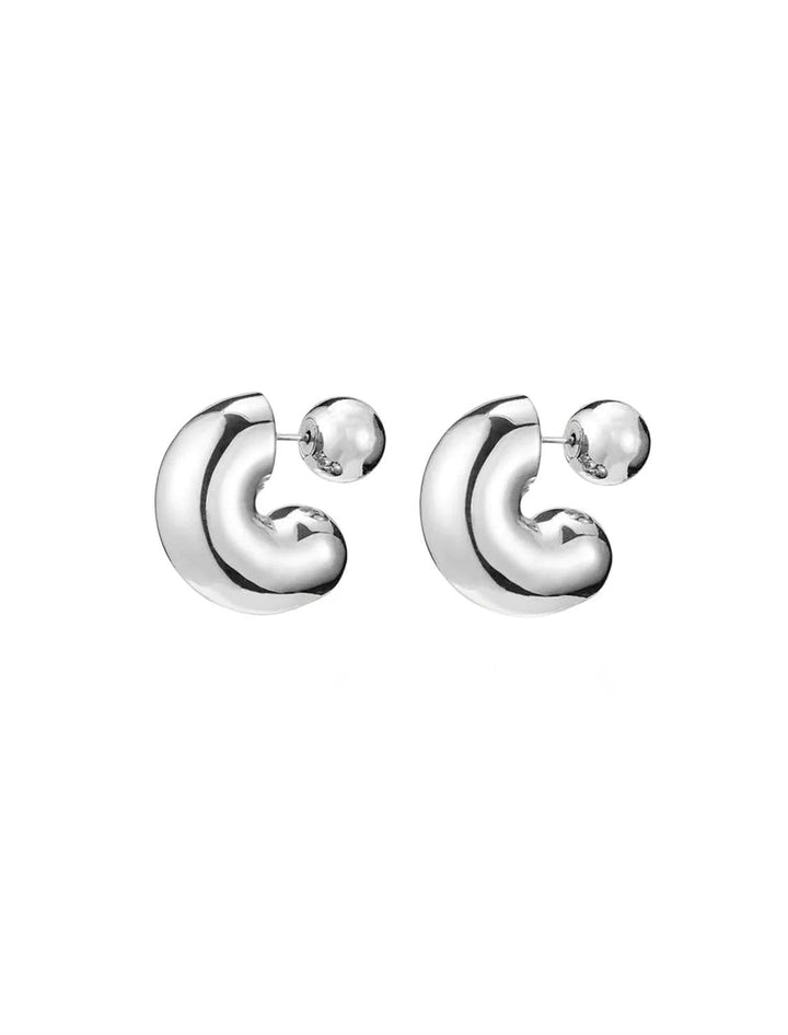 Front angle view of Jenny Bird's Medium Tome Hoops in Silver Dipped Brass.