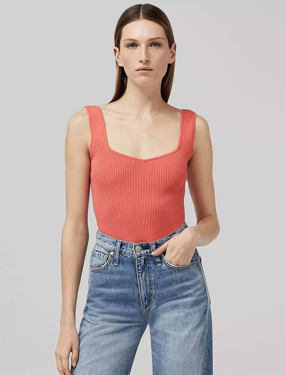 Model wearing Rag & Bone's asher tank in coral.