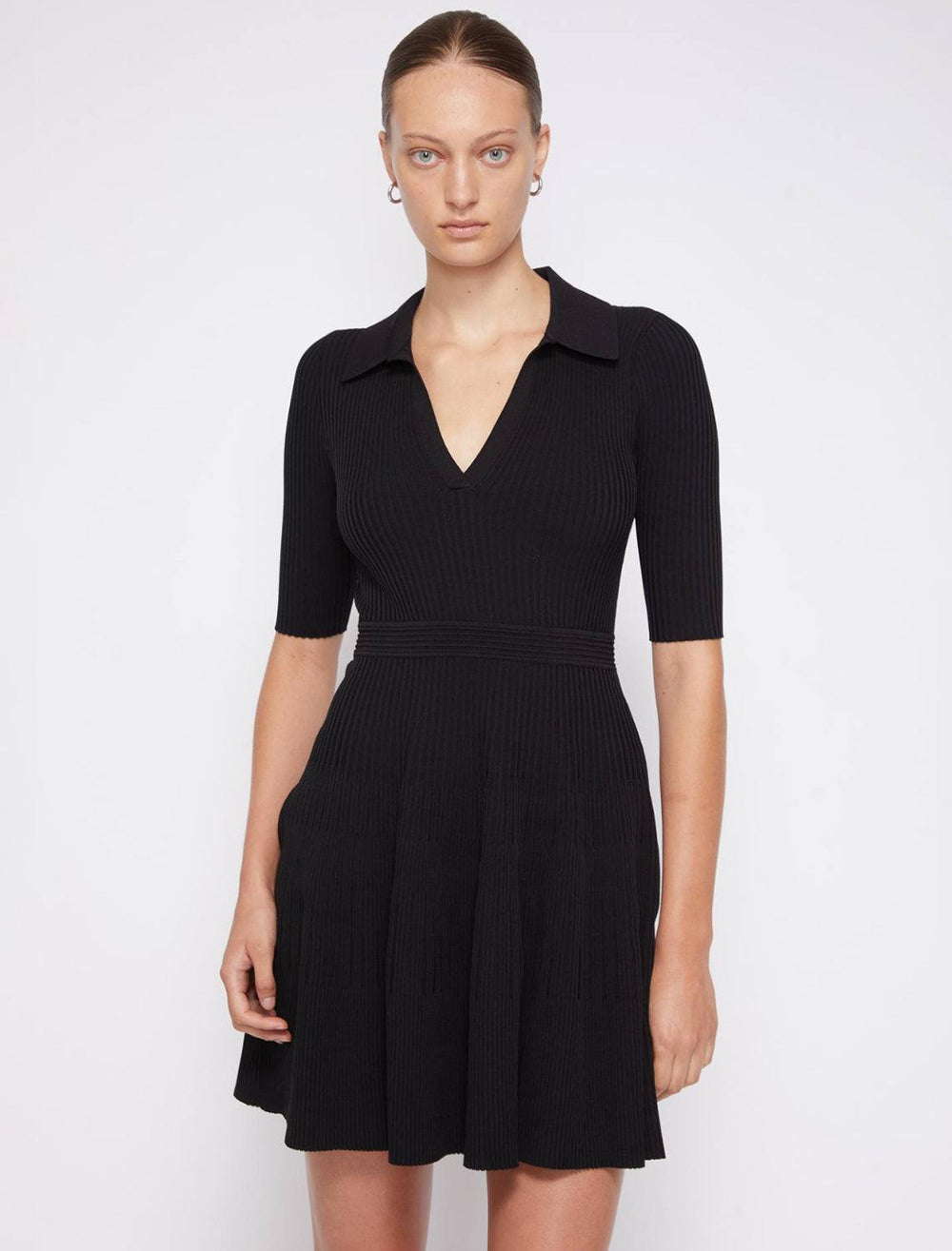 Model wearing Jonathan Simkhai's patricia core compact rib polo dress in black.
