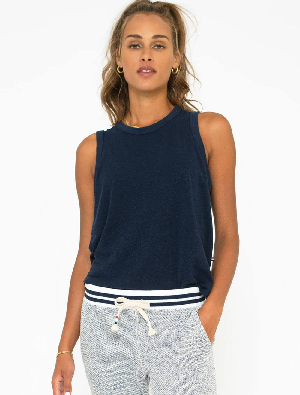 Model wearing Sol Angeles' eco slub tank in indigo.