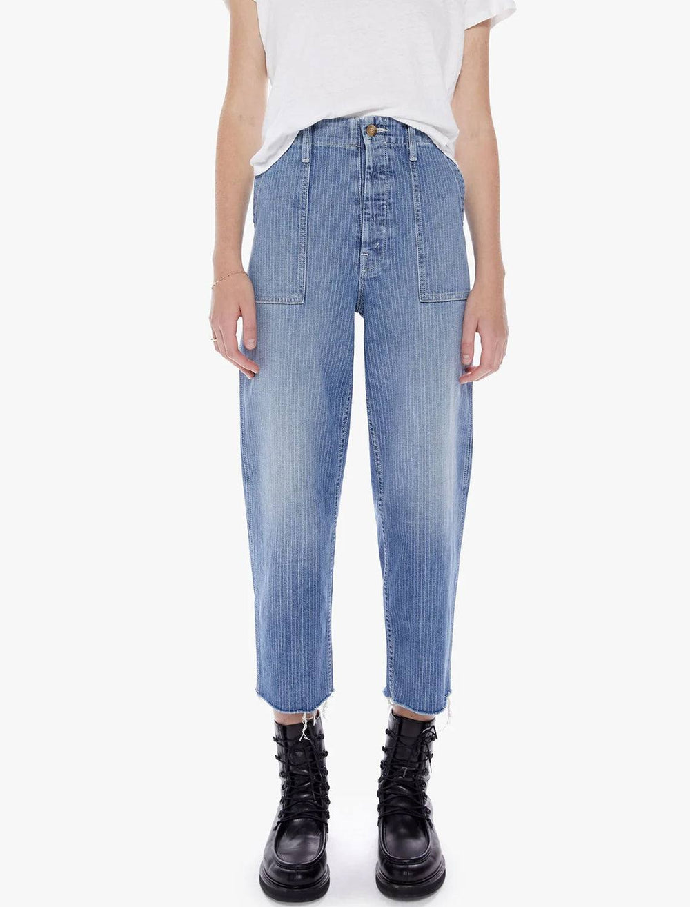 Model wearing Mother Denim's patch pocket ankle fray in on the right track.