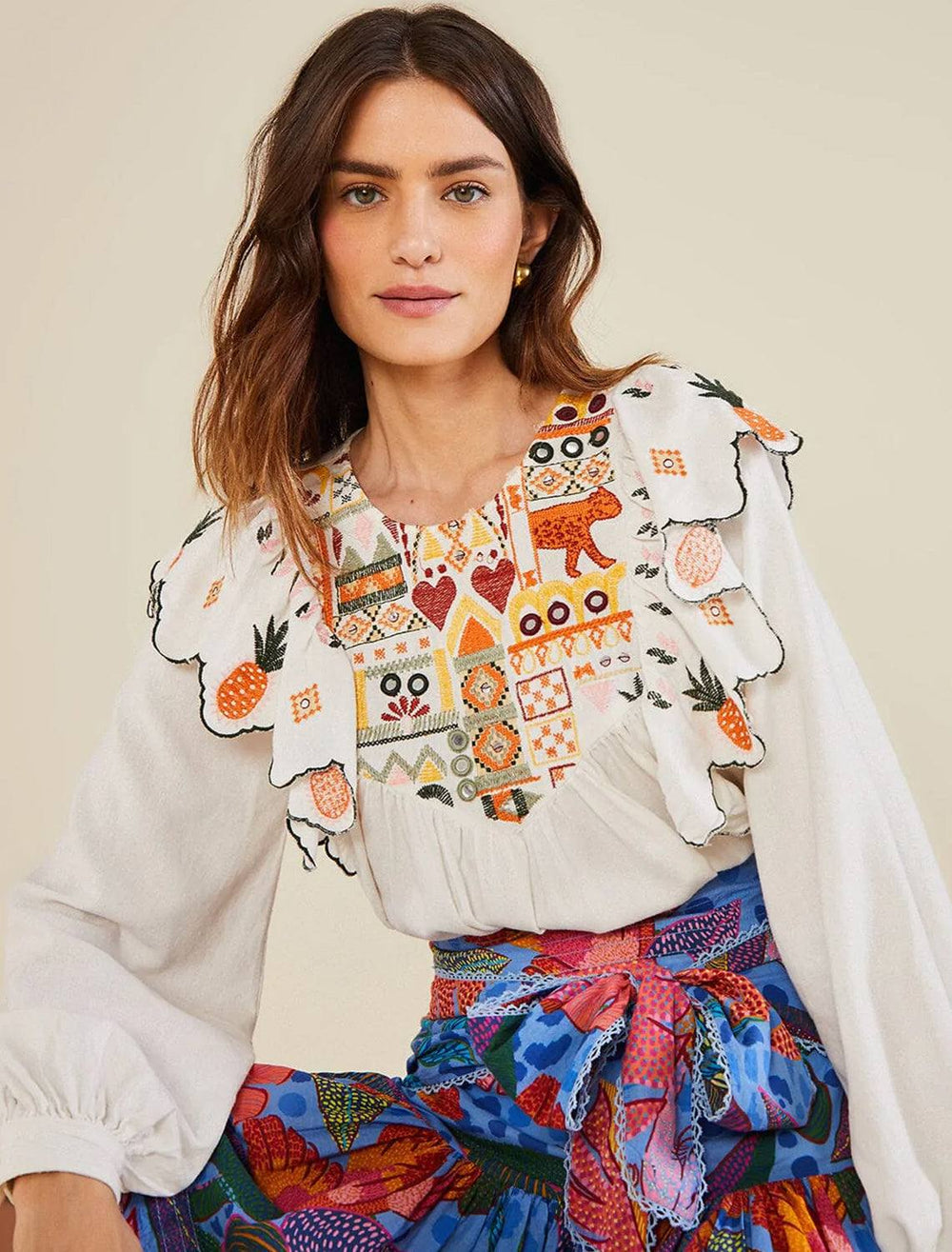 Model wearing Farm Rio's embroidery fall leaf white blouse.