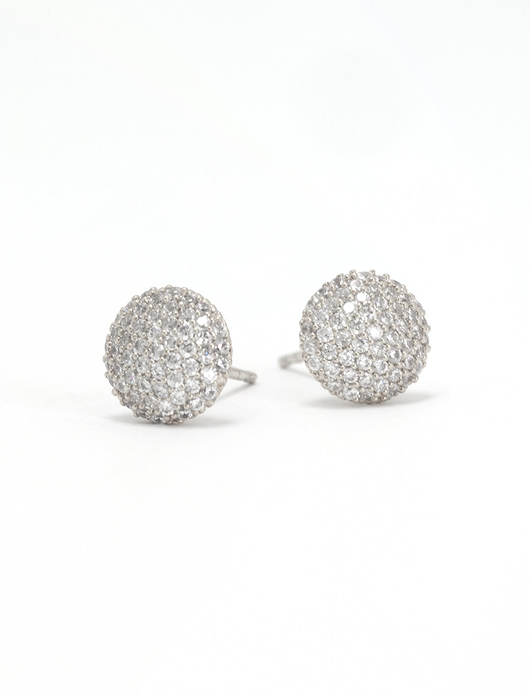 Close-up view of Tai's cz button stud earrings in silver.