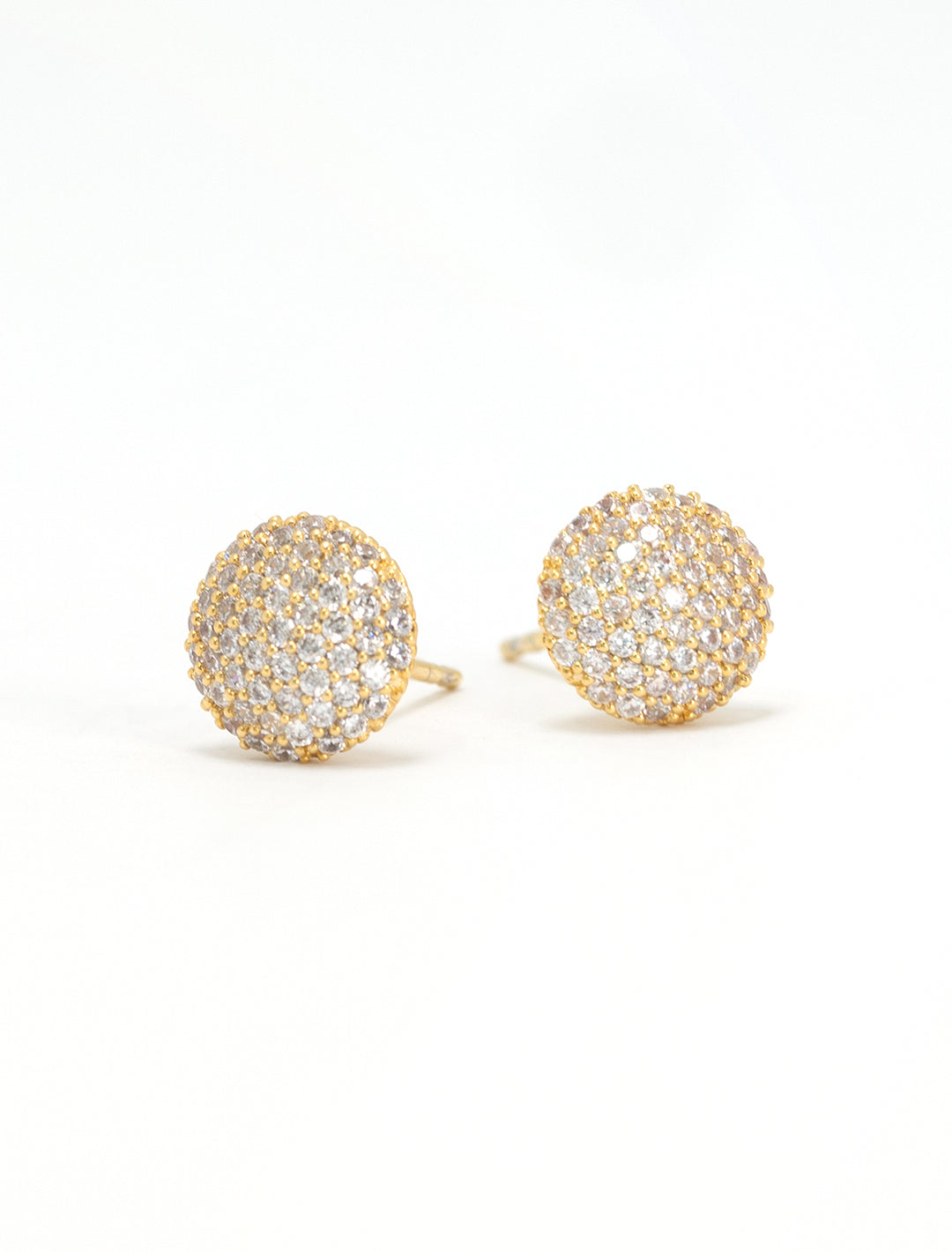 Close-up view of Tai's cz button studs in gold.