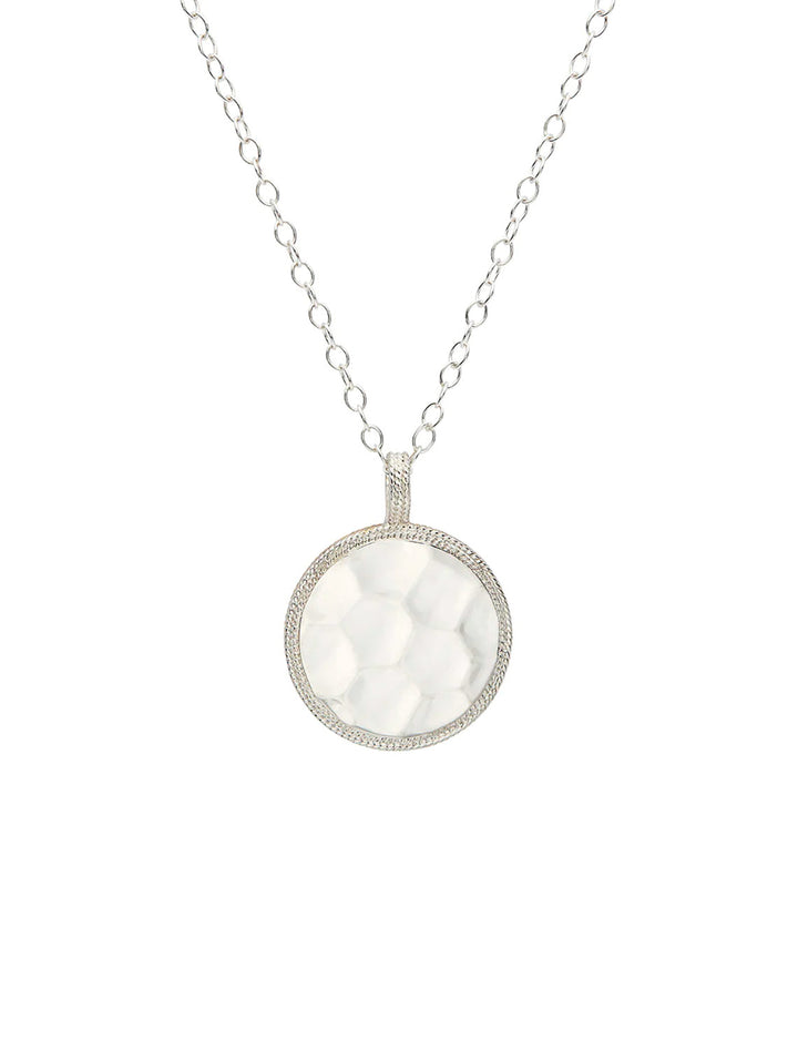Front view of Anna Beck's hammered pendant necklace.