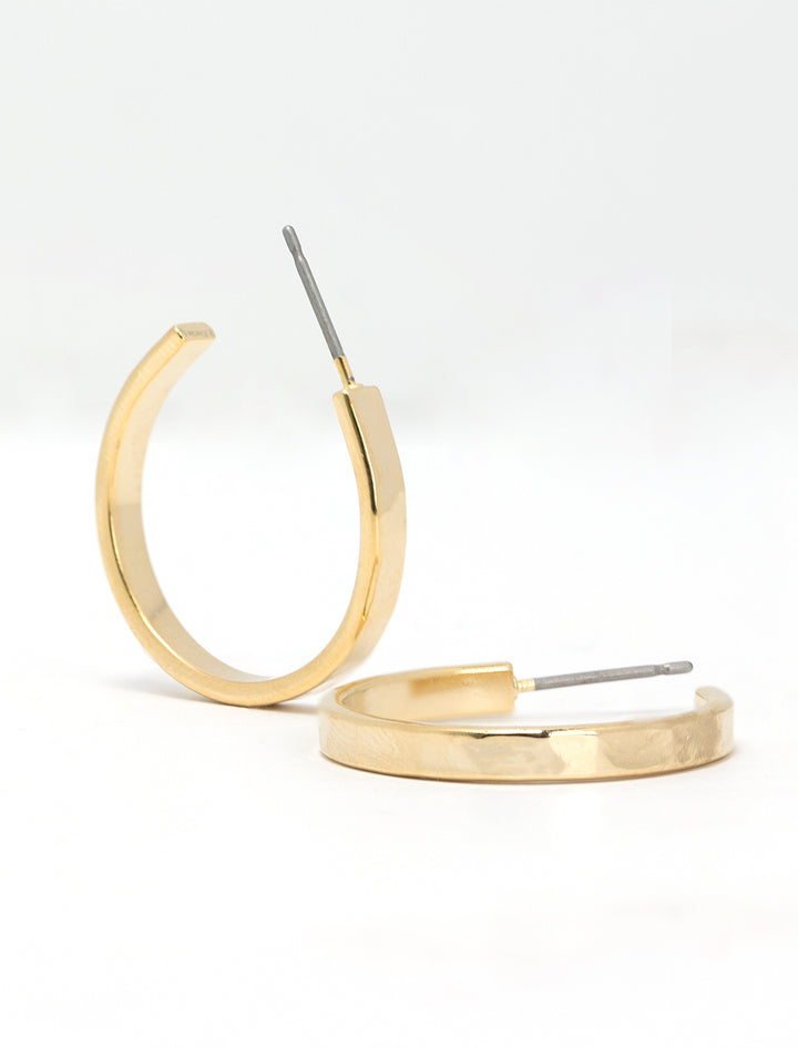 Close-up view of AV Max 3/4 inch hammered gold hoops