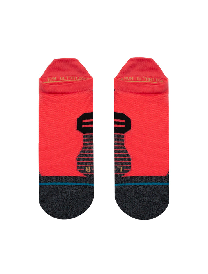 Front view of Stance's ultra tab running socks in neon pink.
