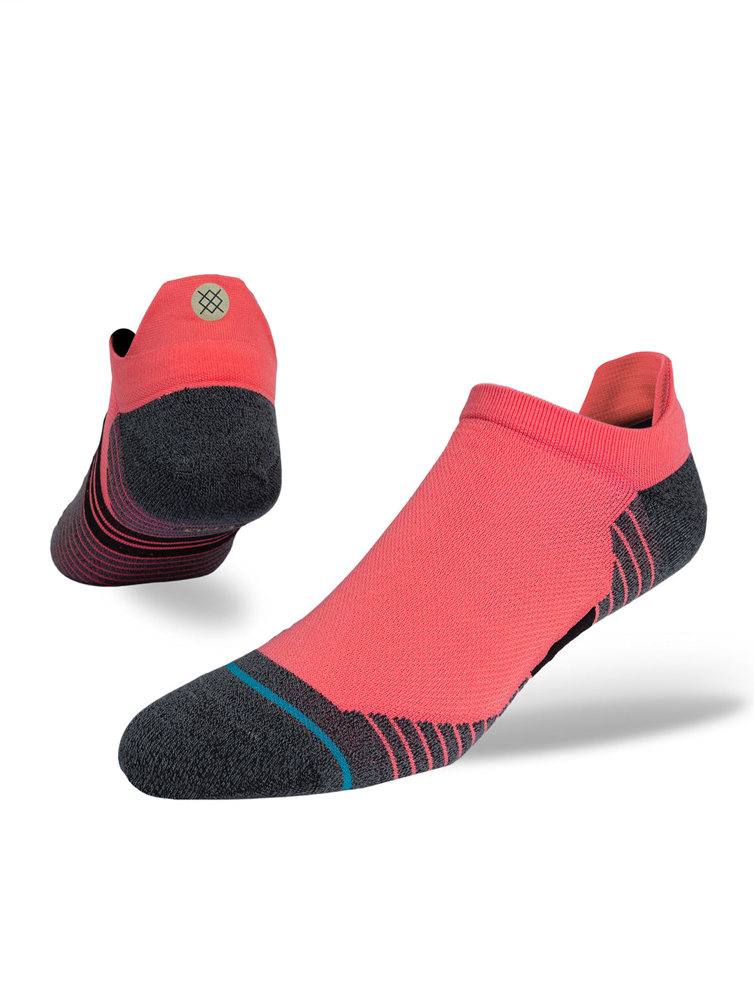 Stance's ultra tab running socks in neon pink on a foot form.