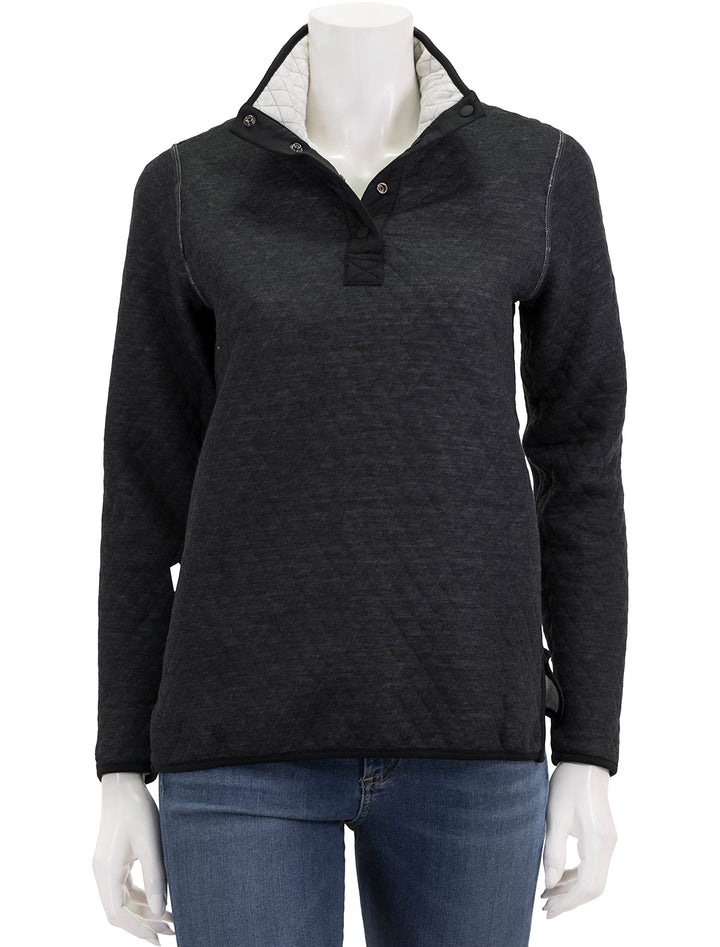 Front view of the reverse side of Marine Layer's corbet reversible pullover in white and black.