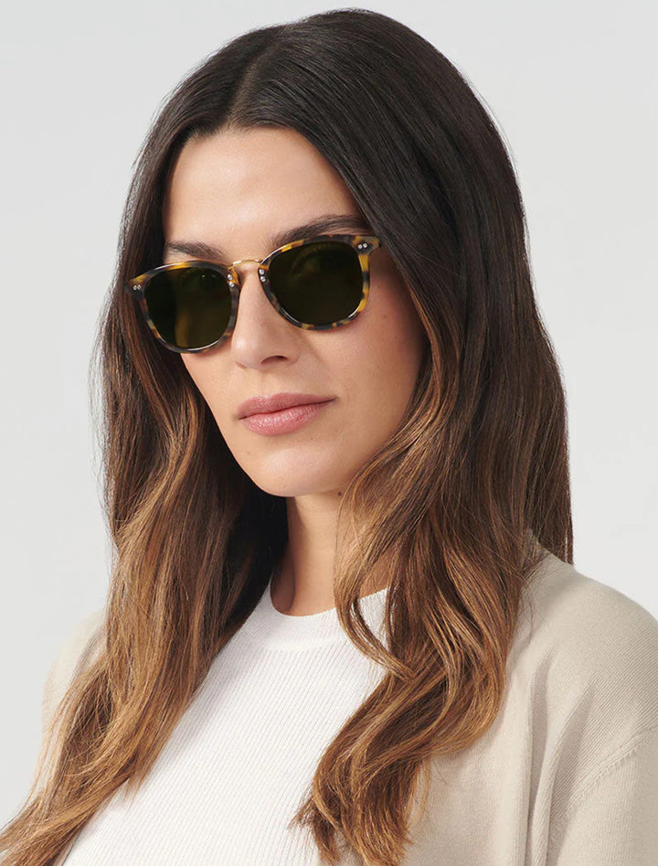 Model wearing Krewe's franklin | blonde tortoise polarized 24k.