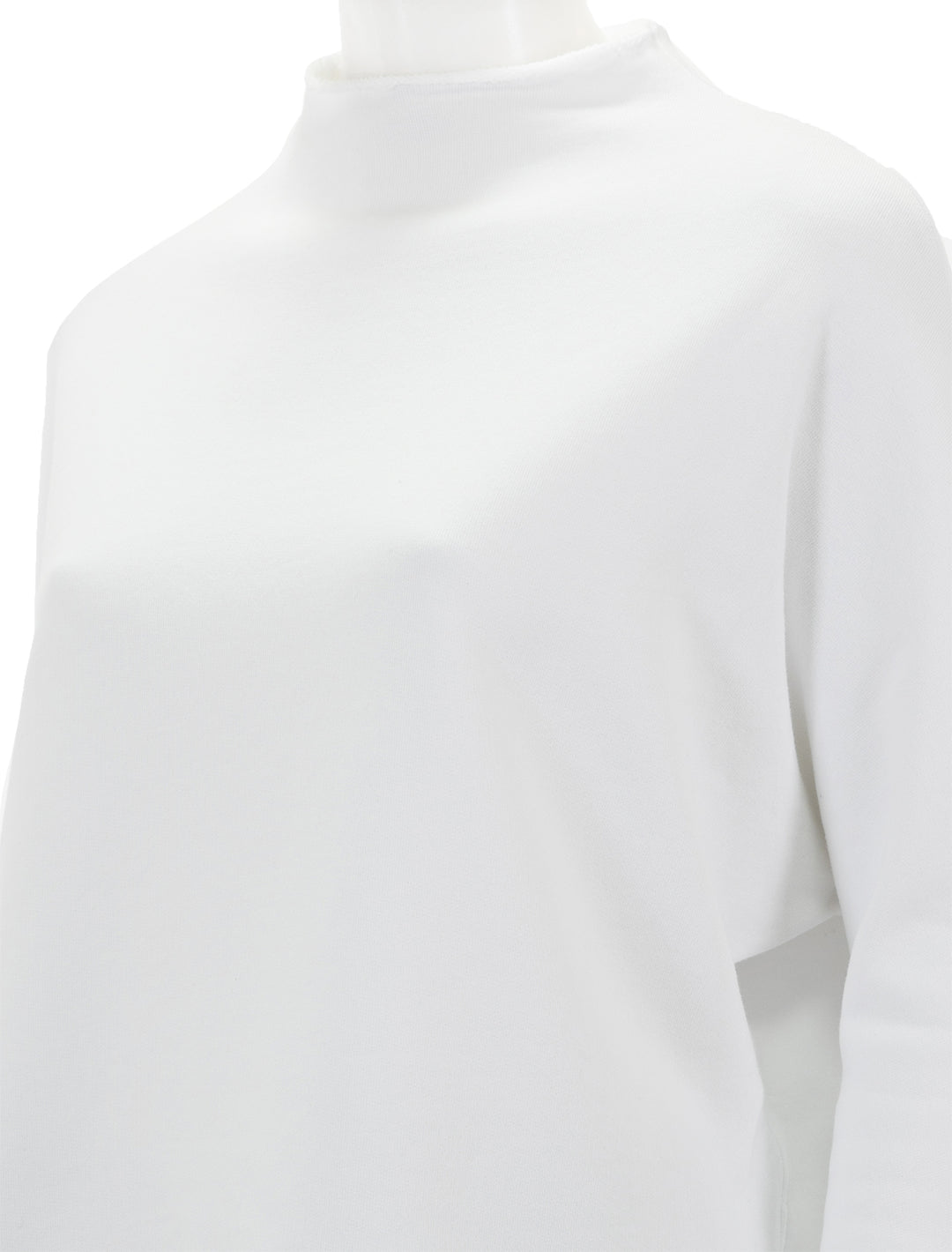 Close-up view of Frank & Eileen's funnelneck capelet in white.