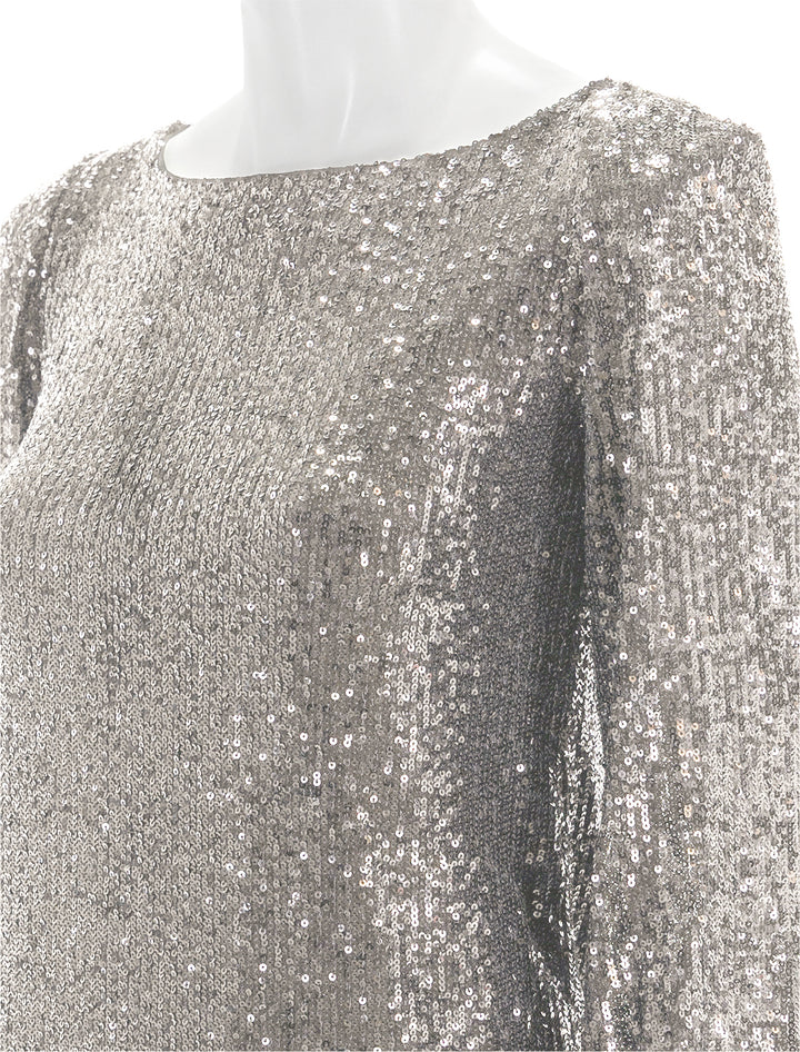 Close-up view of Steve Madden's delorean dress in silver.