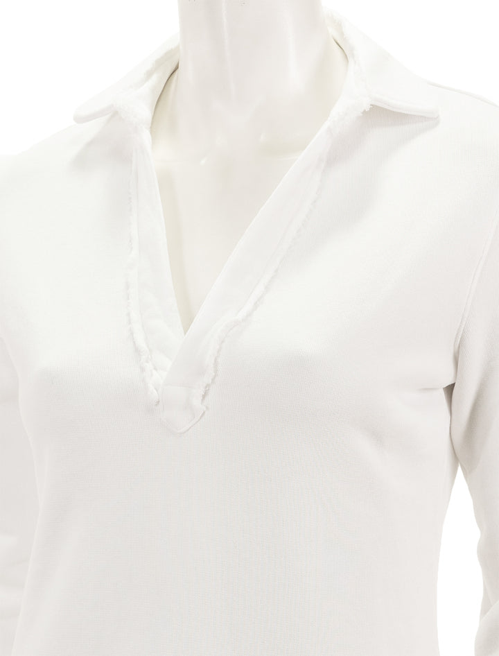 Close-up view of Frank & Eileen's long sleeve polo dress in white.