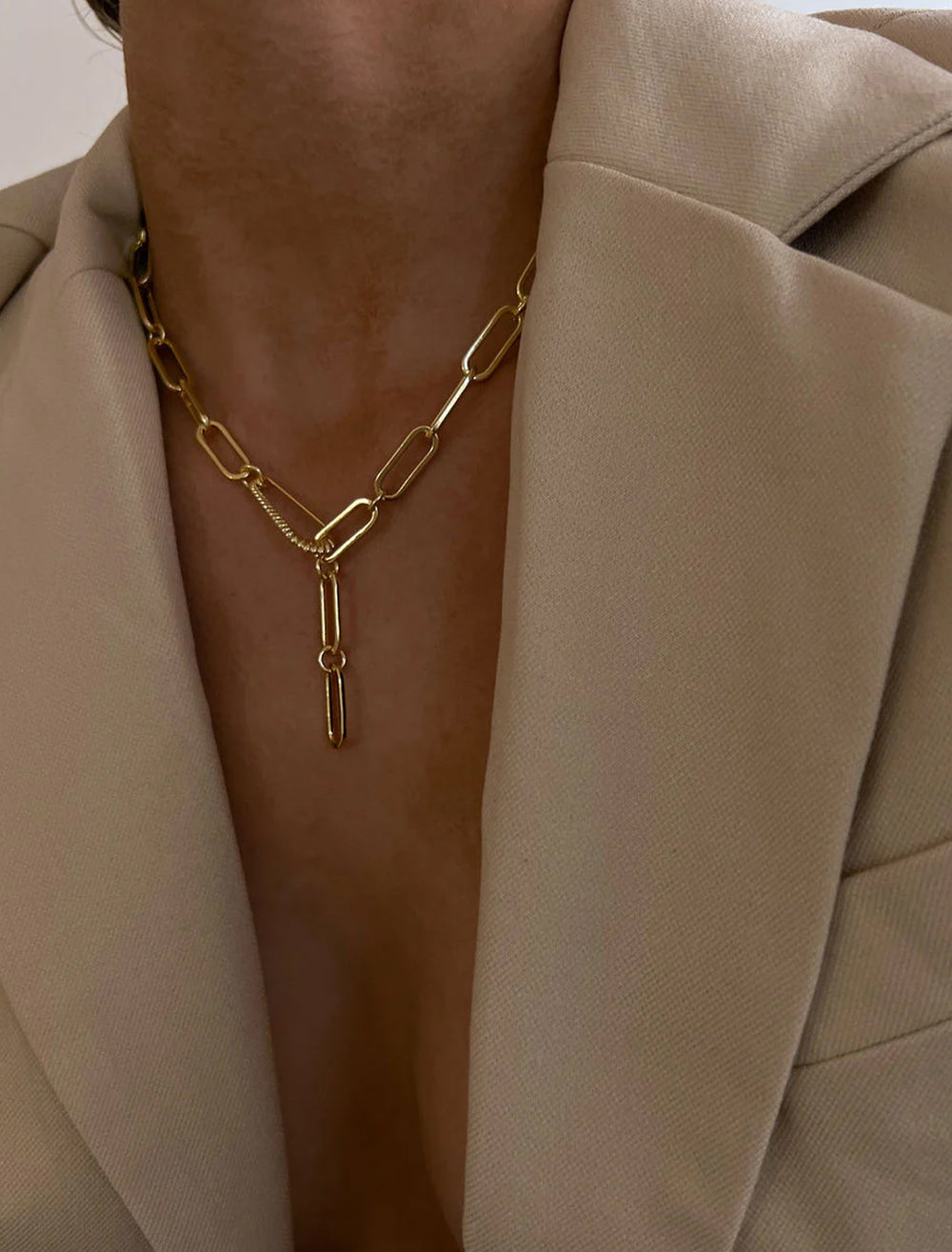 Model wearing LUV AJ's the francois safety pin necklace in gold.