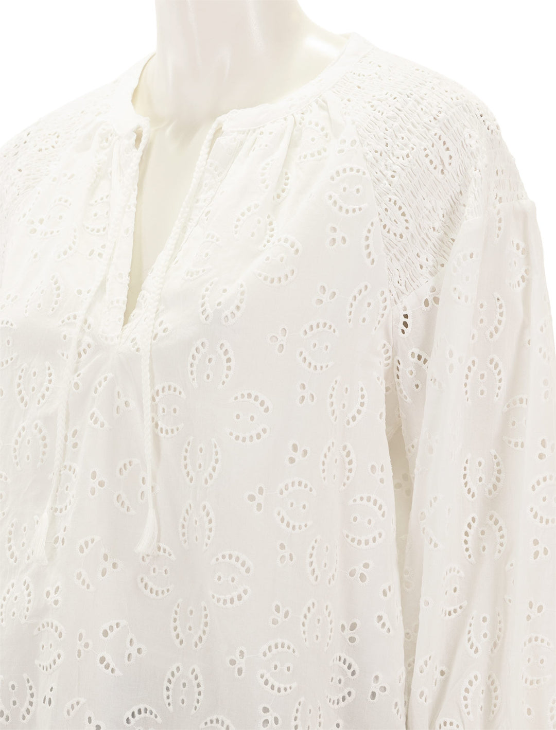 Close-up view of Splendid's taylor eyelet top in white.