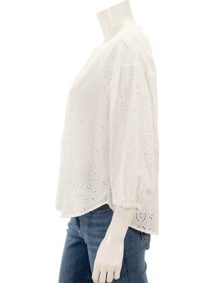 Side view of Splendid's taylor eyelet top in white.