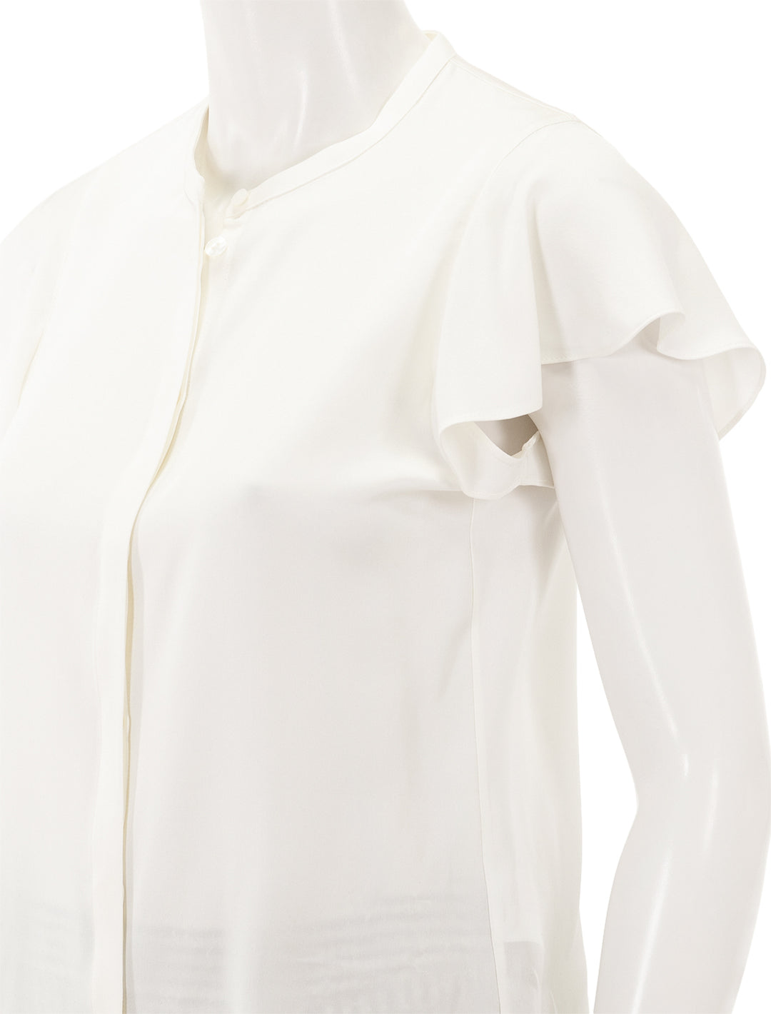 Close-up view of Theory's ruffle sleeve top in ivory.