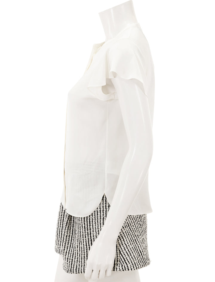 Side view of Theory's ruffle sleeve top in ivory.