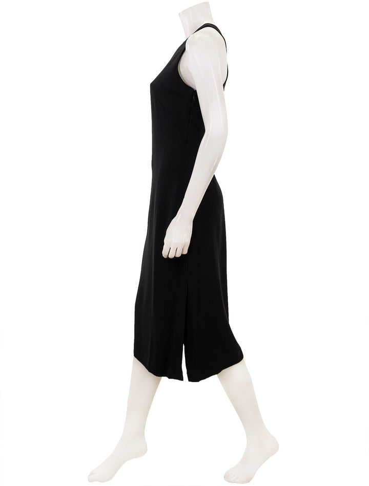 Side view of Theory's cross back midi dress in black.