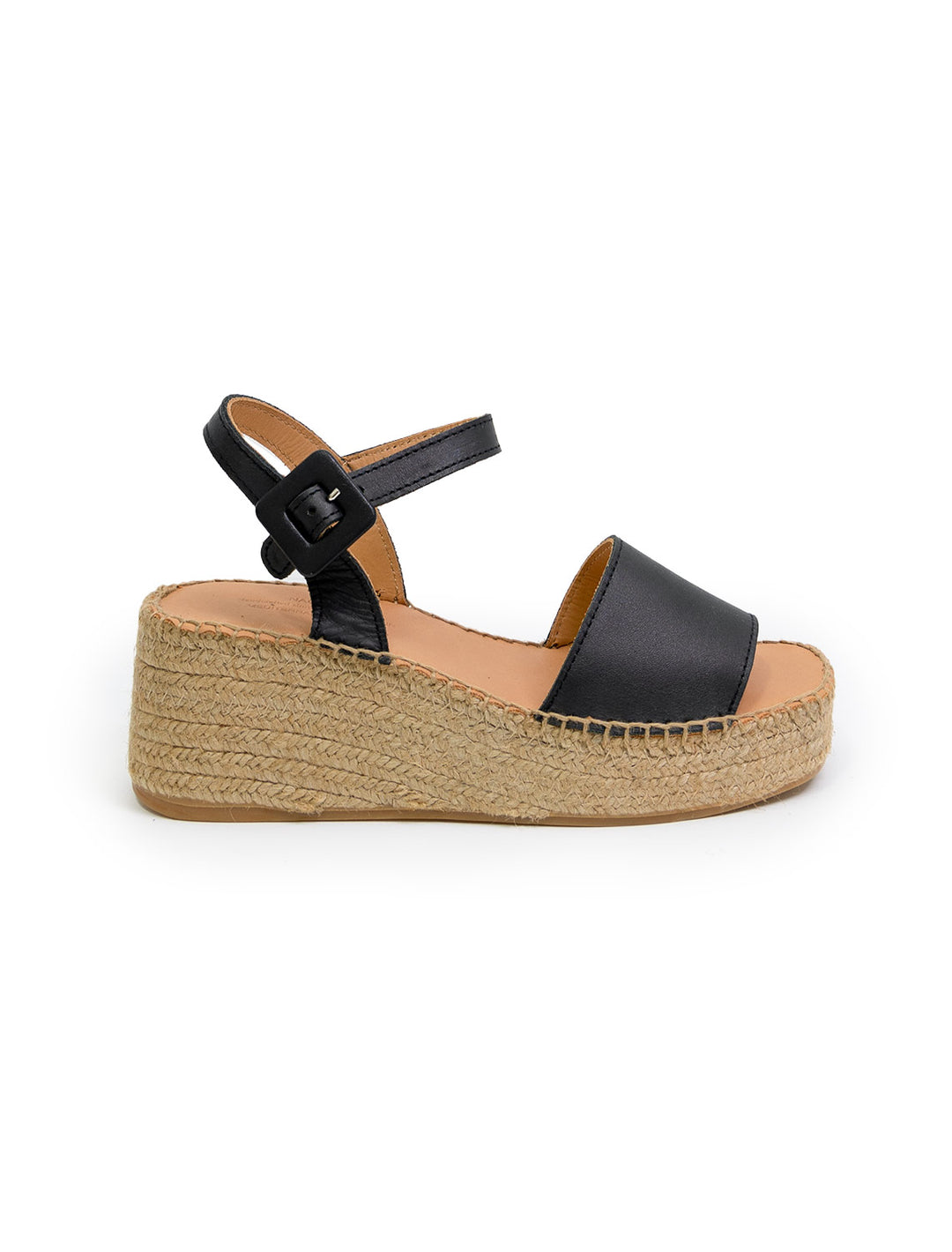 Side view of Naguisa's rall espadrille wedge in black.