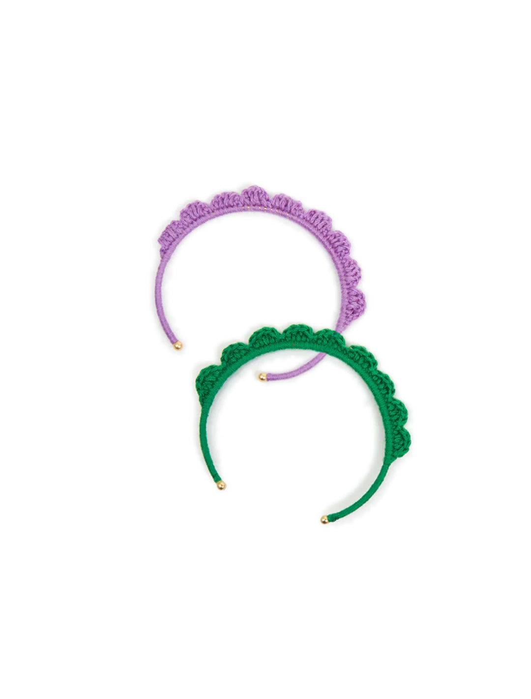 Overhead view of Clare V.'s crochet cuff set in lilac and emerald.
