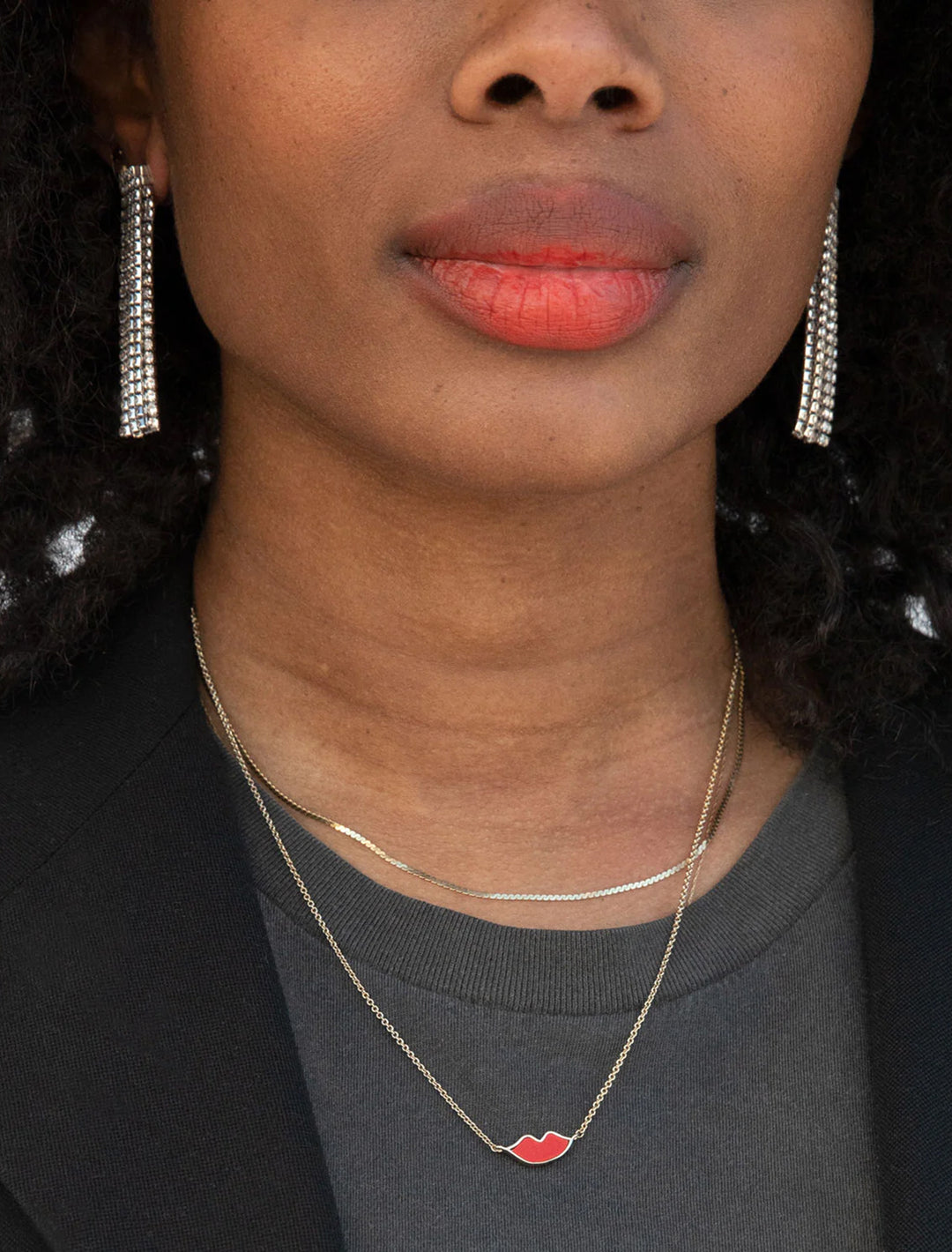 Model wearing Clare V.'s Lips Necklace in Gold.