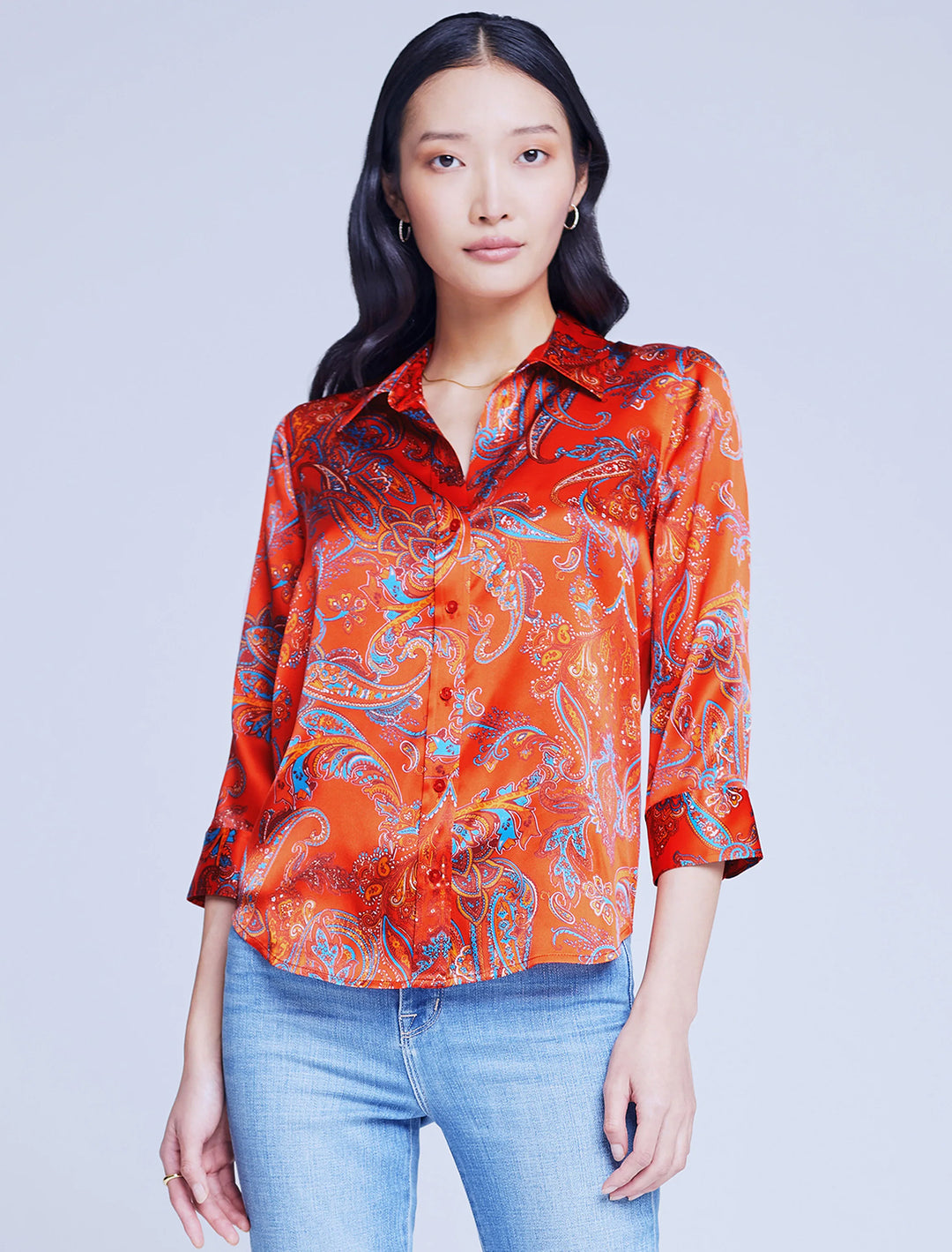 Model wearing L'agence's dani shirt in fire red paisley.