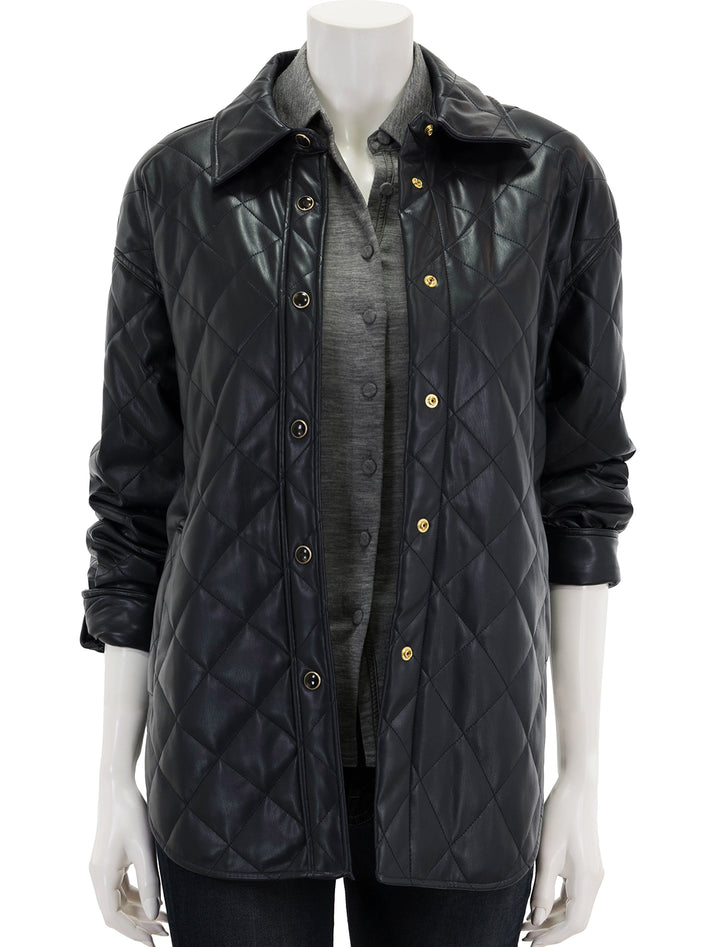 Front view of Scotch & Soda's faux leather quilted shirt jacket in night.