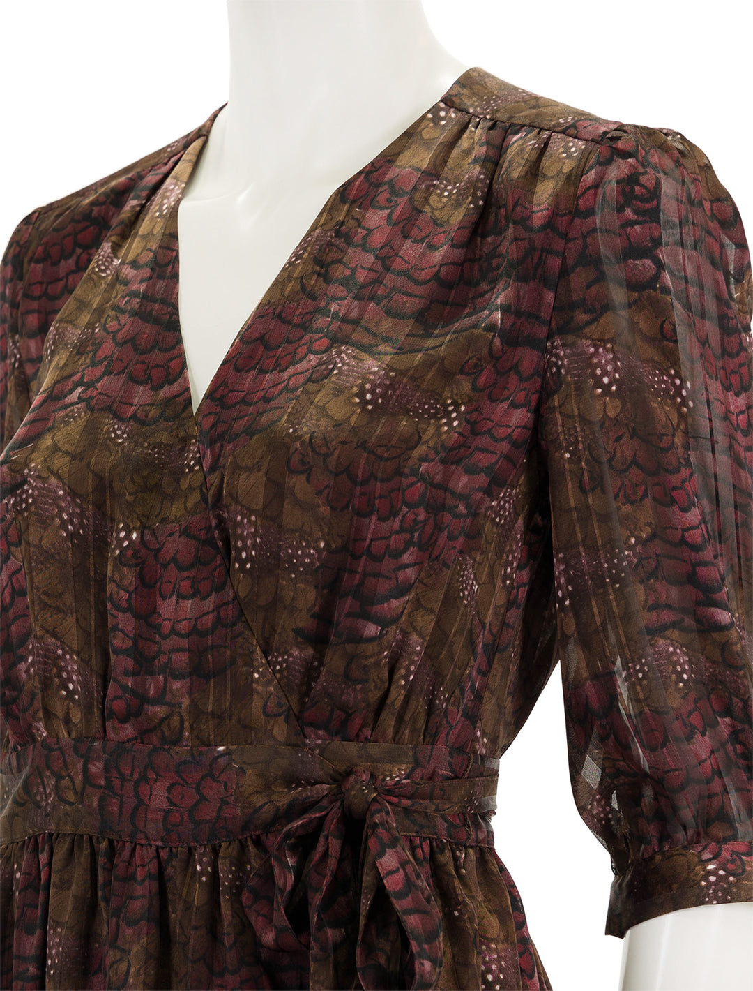 Close-up view of Scotch & Soda's asymmetric wrap dress in feather bordeaux.