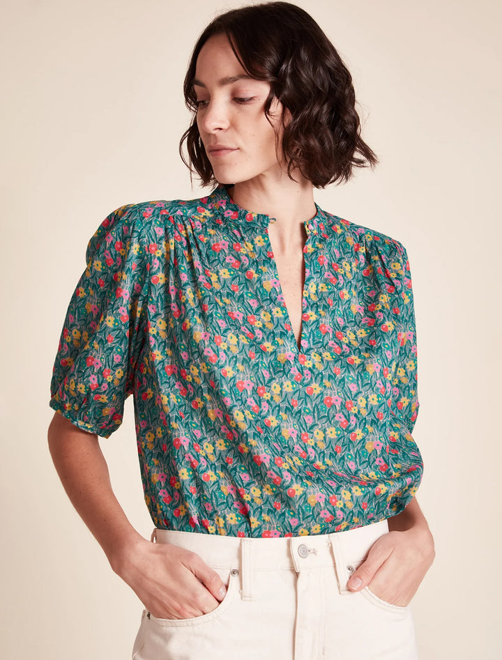 Model wearing Birds of Paradis' aline blouse in bold leaflet.