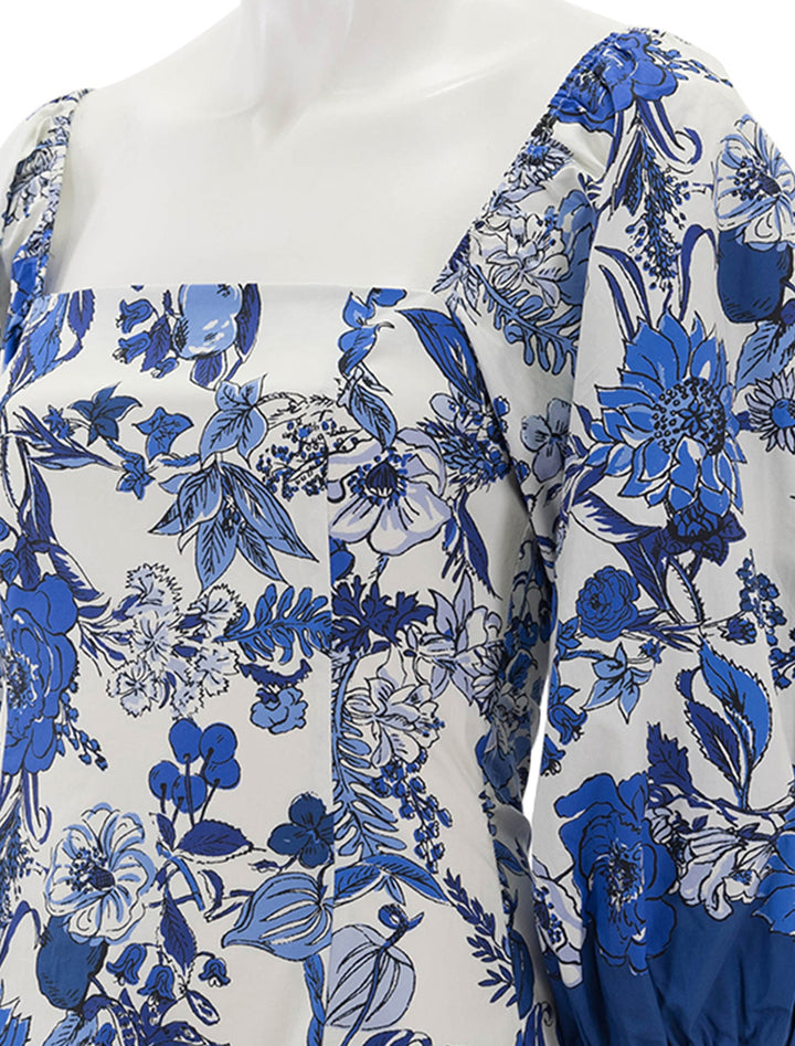 Close-up view of Cara Cara's montauk dress in flower grid blue.
