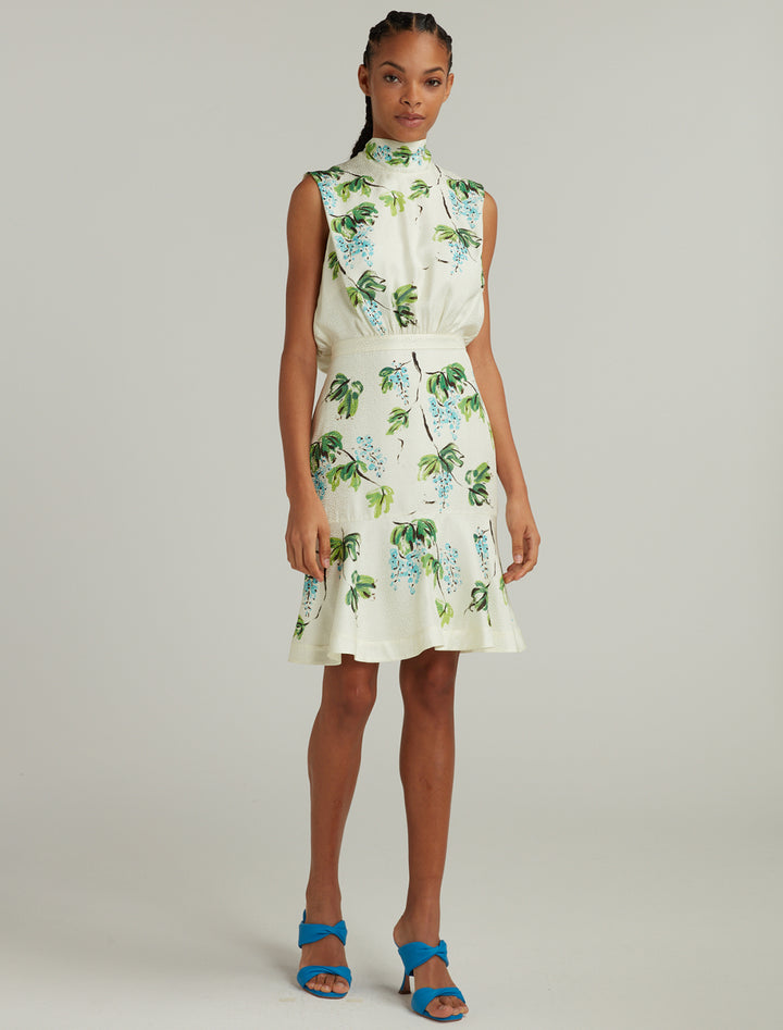 Model wearing Saloni's fleur short dress in blueberry placement.