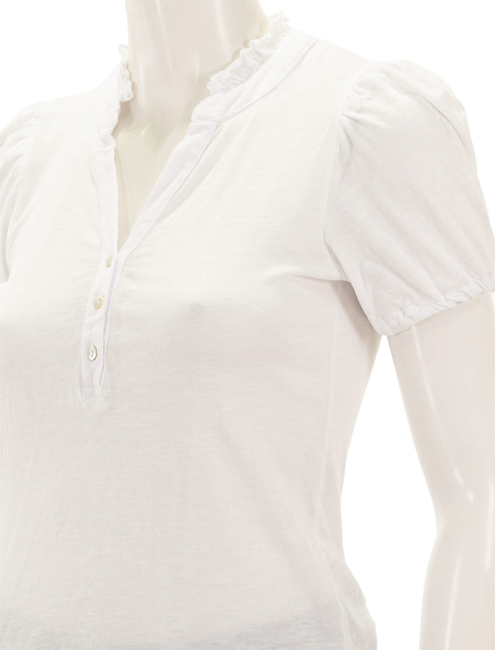 Close-up view of Sundry's short sleeve ruffleneck henley in white.