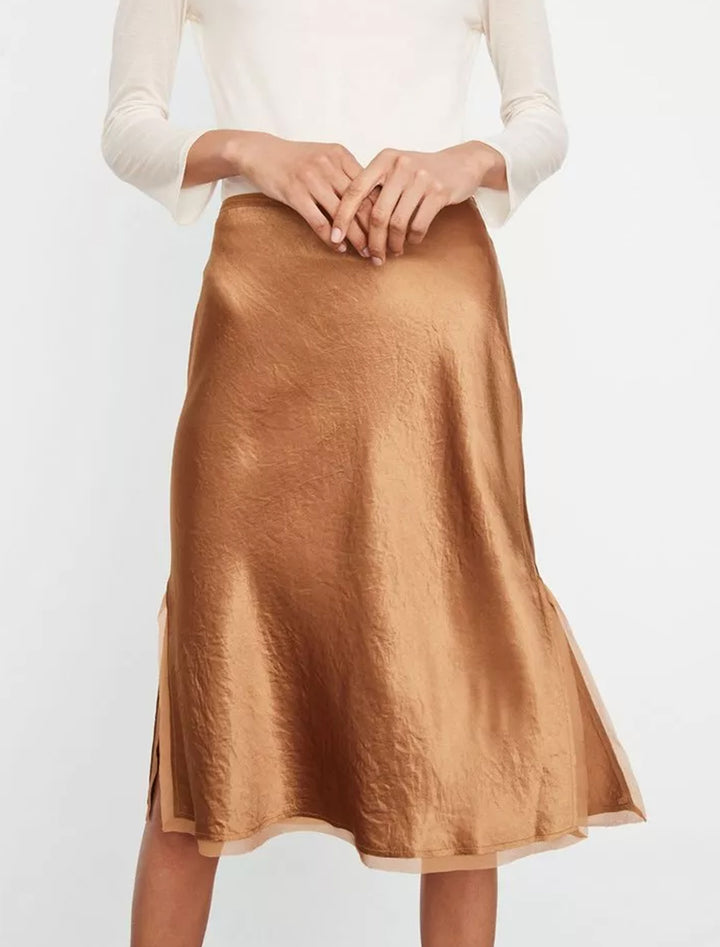 Model wearing Vince's chiffon trim slip skirt in nile.