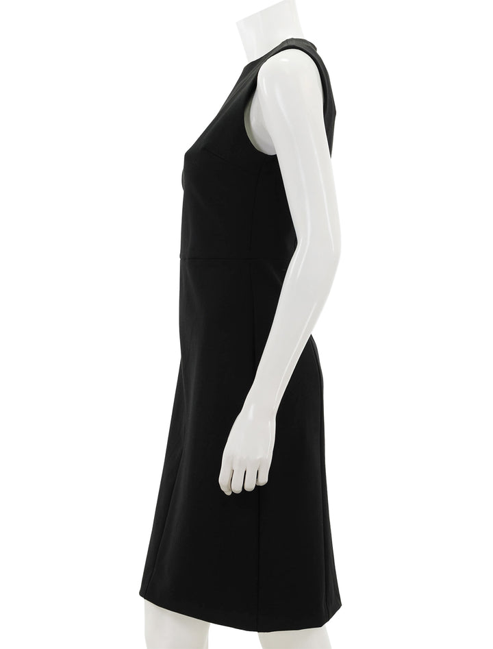 Side view of Vince's seamed front sheath dress in black.