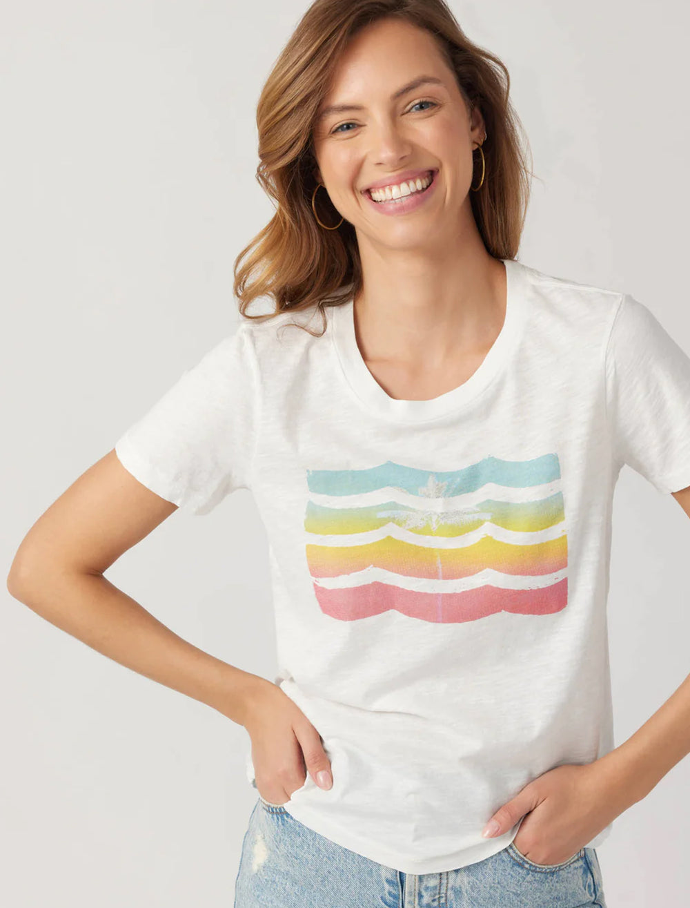 Model wearing Sol Angeles' pride rainbow waves crew tee.