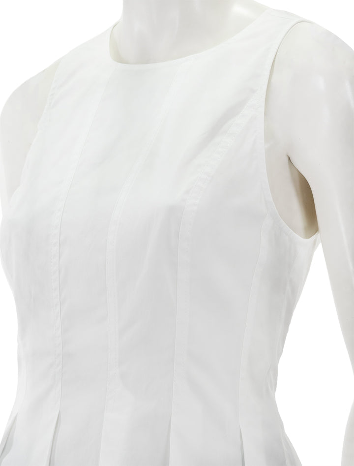 Close-up view of Veronica Beard's olympia top in white.