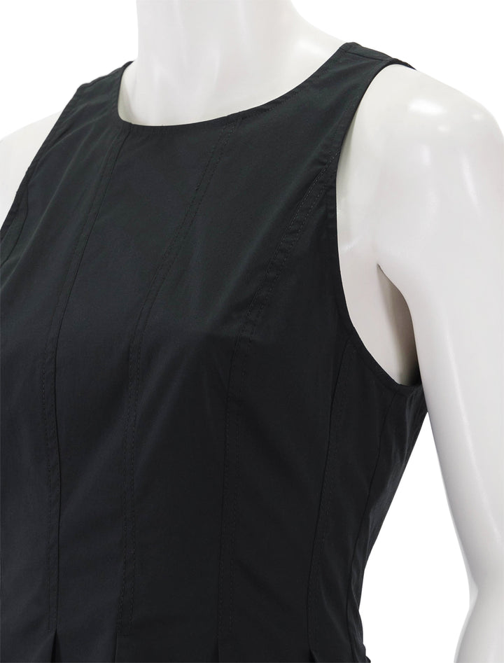 Close-up view of Veronica Beard's olympia top in black.