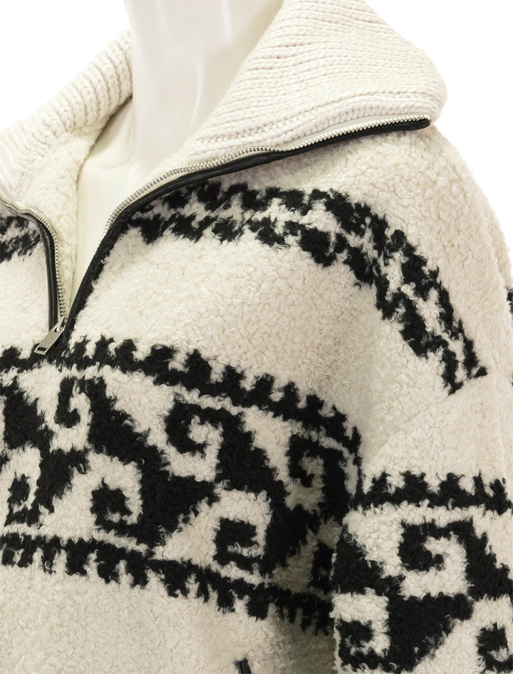 Close-up view of Isabel Marant's marner pullover in ecru.